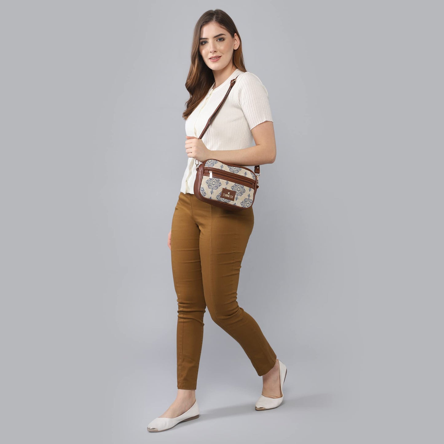 The Clownfish Nyra Polyester Crossbody Sling Bag for Women Casual Party Bag Purse with Adjustable Shoulder Strap.