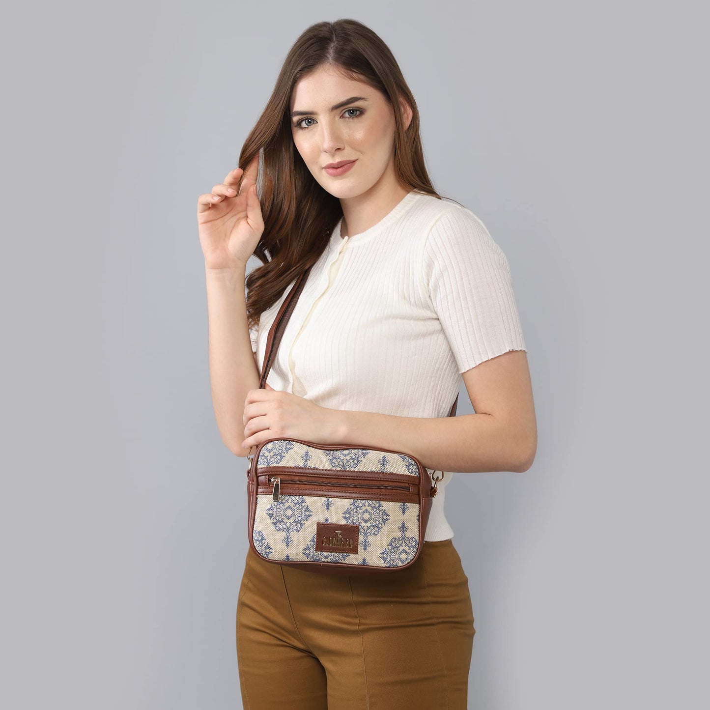 The Clownfish Nyra Polyester Crossbody Sling Bag for Women Casual Party Bag Purse with Adjustable Shoulder Strap.