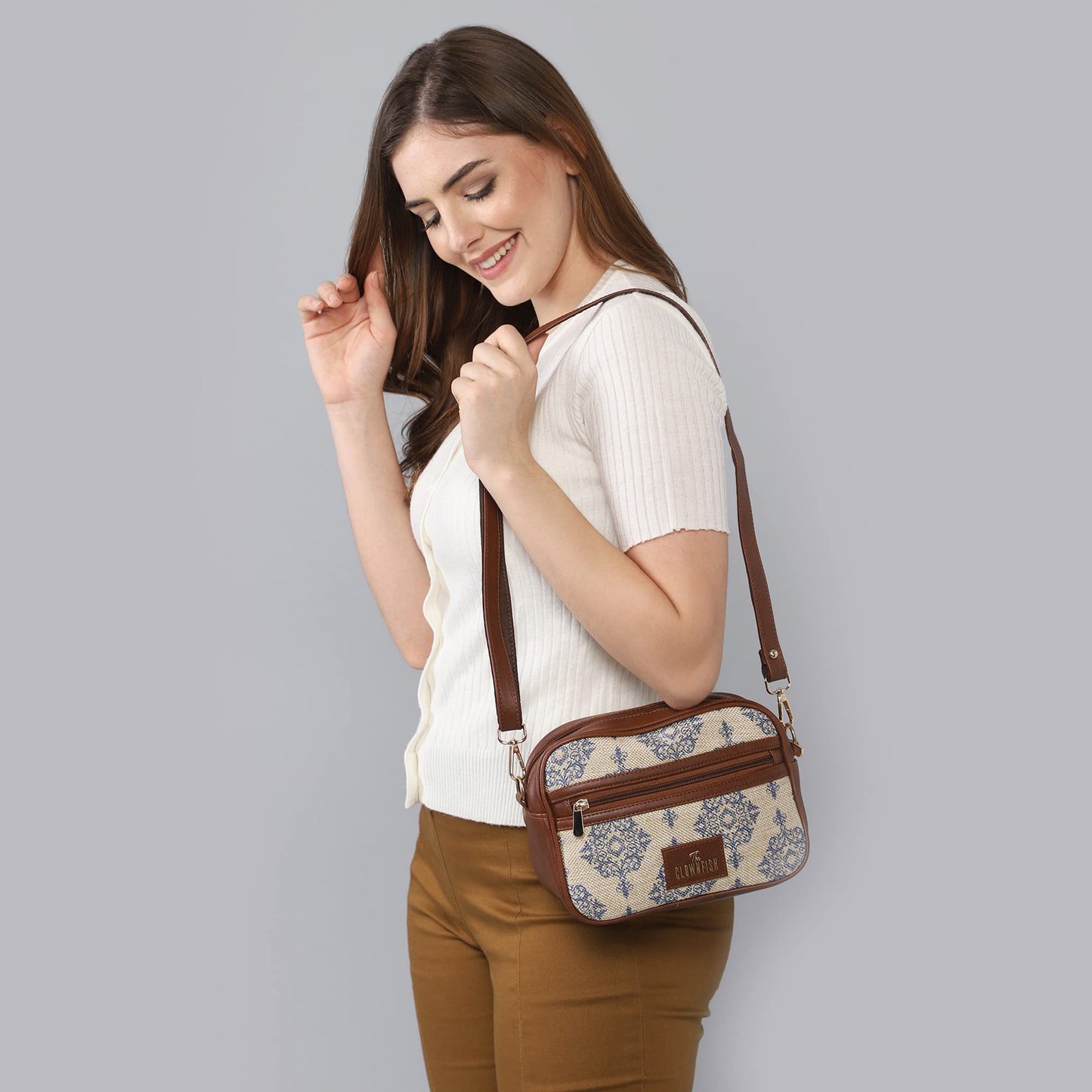 The Clownfish Nyra Polyester Crossbody Sling Bag for Women Casual Party Bag Purse with Adjustable Shoulder Strap.